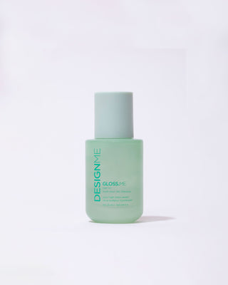 Travel-size GLOSS.ME Hair Oil bottle in front view, showcasing its sleek and portable design.