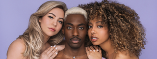 Close-up of three models showcasing curly, wavy, and bleached hair styled using DESIGNME products.