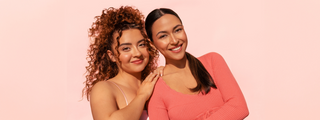 Two models one with 3A curls, the other with a sleek back style, showing off polished, styled hair.