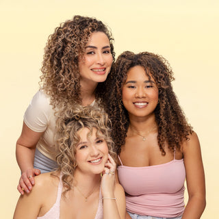 Three women with defined, healthy curls and waves in varying textures, from loose waves to tight curls, styled with DESIGNME BOUNCE.ME curl and wave products.