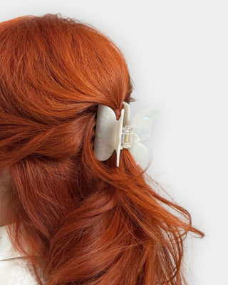 DESIGNME butterfly hair clip holds securely in beautiful red hair.