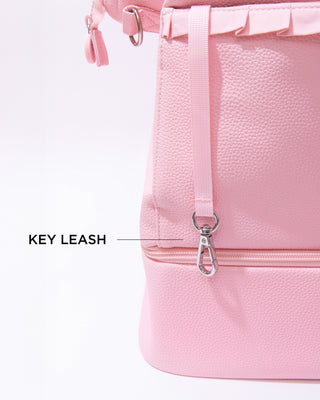 Showcasing the hidden key leash to keep your keys attached to the bag.