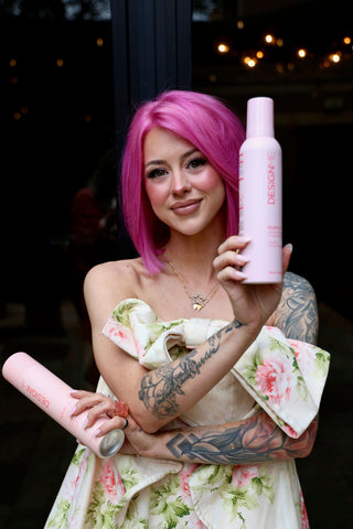 Hairstylist and makeup artist Ally Nicole holding DESIGNME PUFF.ME volumizing mousse & HOLD.ME 3-way hairspray.