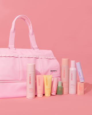 PUFF.ME volumizing mousse, PUFF.ME dry texture spray, PUFF.ME volumizing powder, HOLD.ME styling stick, HOLD.ME 3-way hairspray, HOLD.ME styling cream, BOUNCE.ME curl balm, GLOSS.ME hair oil FAB.ME leave-in sitting in the pockets of the Ally Nicole Travel Beauty Bag.