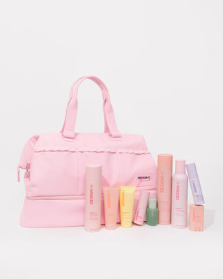 Ally Nicole x DESIGNME Travel Beauty Bag with the stylist bundle products sitting in front of the bag.