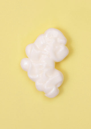 Close-up of BOUNCE.ME Curl Conditioner Discovery Size texture showing  a rich, nourishing creamy formula