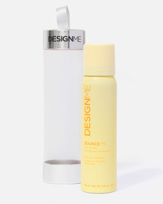 BOUNCE.ME curl mousse displayed outside the packaging on a grey background.