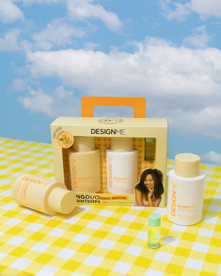 BOUNCE.ME spring duo for curls sitting on yellow gingham blanket.