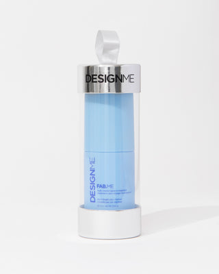 FAB.ME multi-vitamin leave-in treatment holiday ornament sits on a grey background.