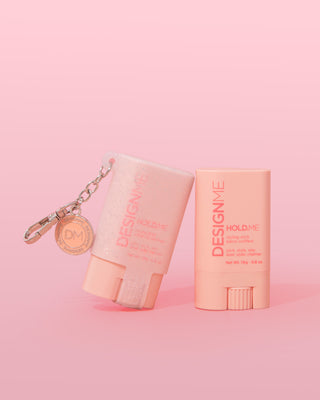 HOLD.ME styling stick glitter pouch on pink background.
