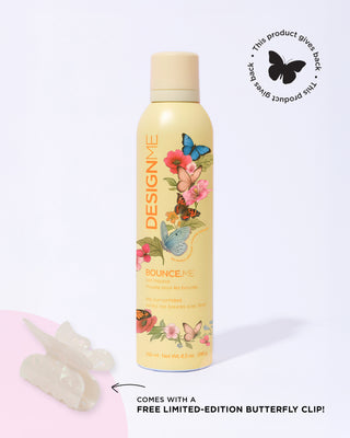 Limited-edition Women's Month BOUNCE.ME curl mousse on a grey background. In the corner is a sticker that says 'This product gives back'. Comes with a free limited-edition butterfly clip.