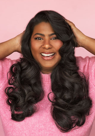 Model with gorgeous long, fluffy hair showing volume and shine after using the PUFF.ME Volumizing Wash Day Bundle.