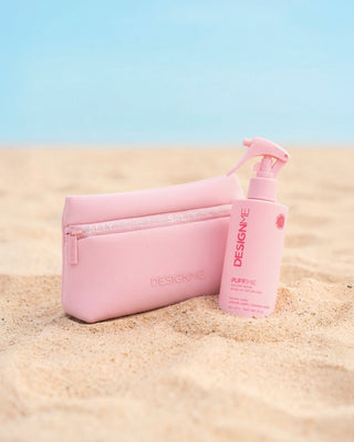 Limited edition water resistant pouch sitting next to PUFF.ME sea salt spray on the beach.