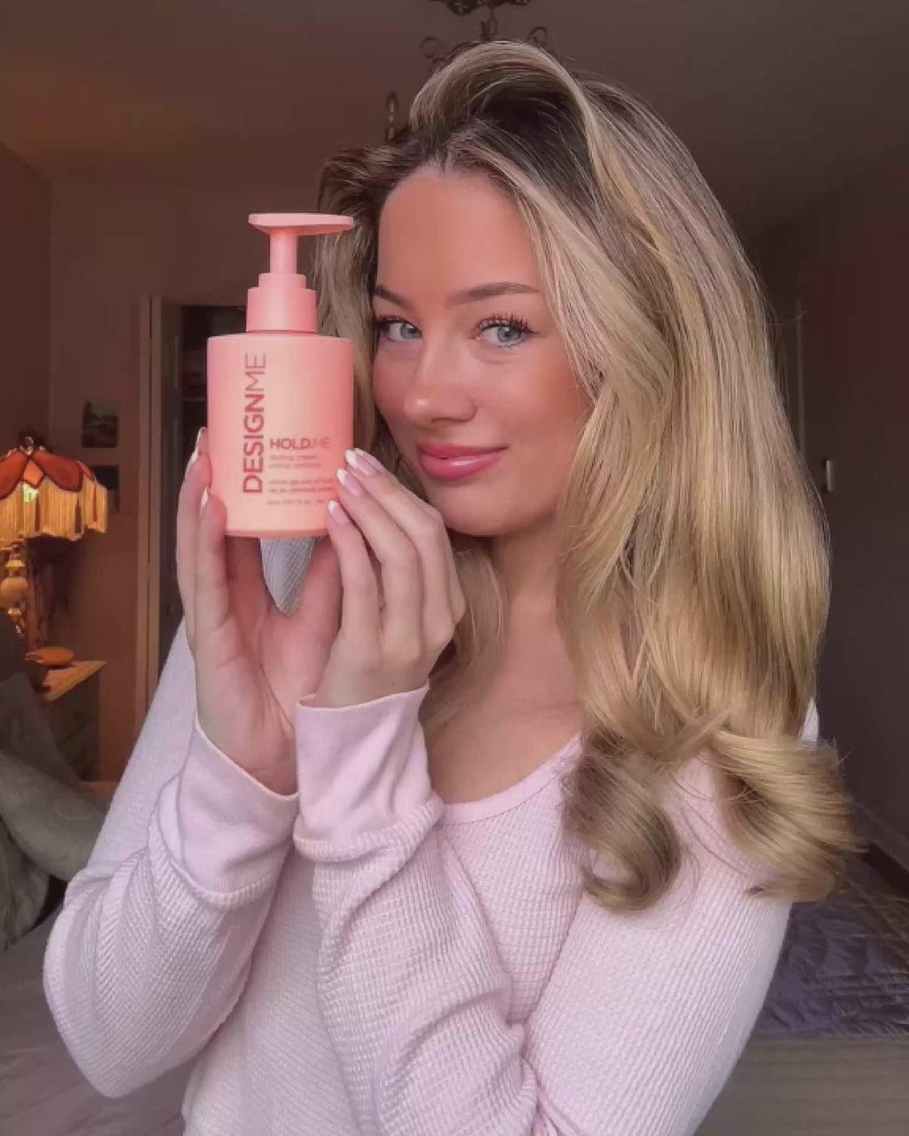 Sarah using HOLD.ME styling cream to create a frizz-free, bouncy blowout.