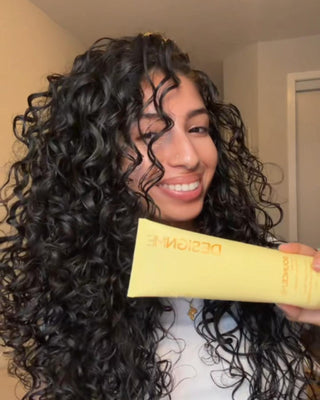 Maysa using BOUNCE.ME curl balm as a 1-step routine for bouncy, shiny, defined curls.